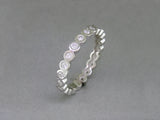 BEZEL SET ROUND DIAMOND ETERNITY RING