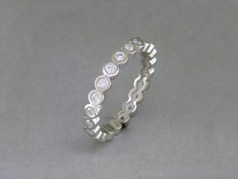 BEZEL SET ROUND DIAMOND ETERNITY RING