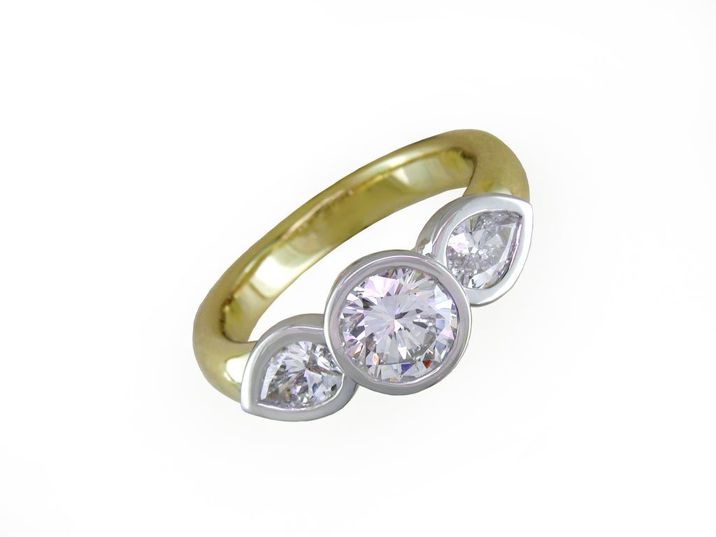ROUND & PEAR SHAPE DIAMOND RING