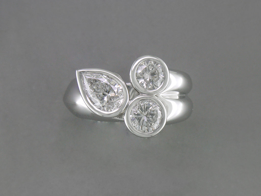 PEAR SHAPE & ROUND DIAMOND RING