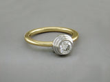 DIAMOND RING IN PLATINUM AND 14K YELLOW GOLD
