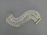 7-STRAND SILVER BRACELET WITH YELLOW GOLD CLASP